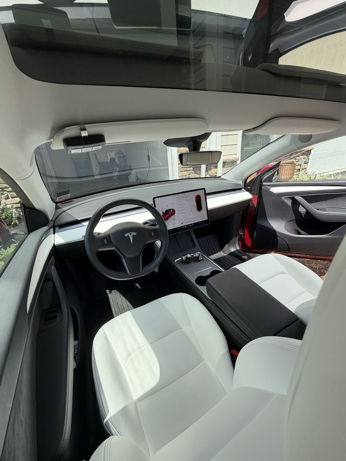 Clean white interior and dashboard of a Tesla Model Y